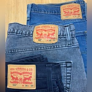 3 pair Levi’s 502 36x29 in black, washed grey and washed blue.
